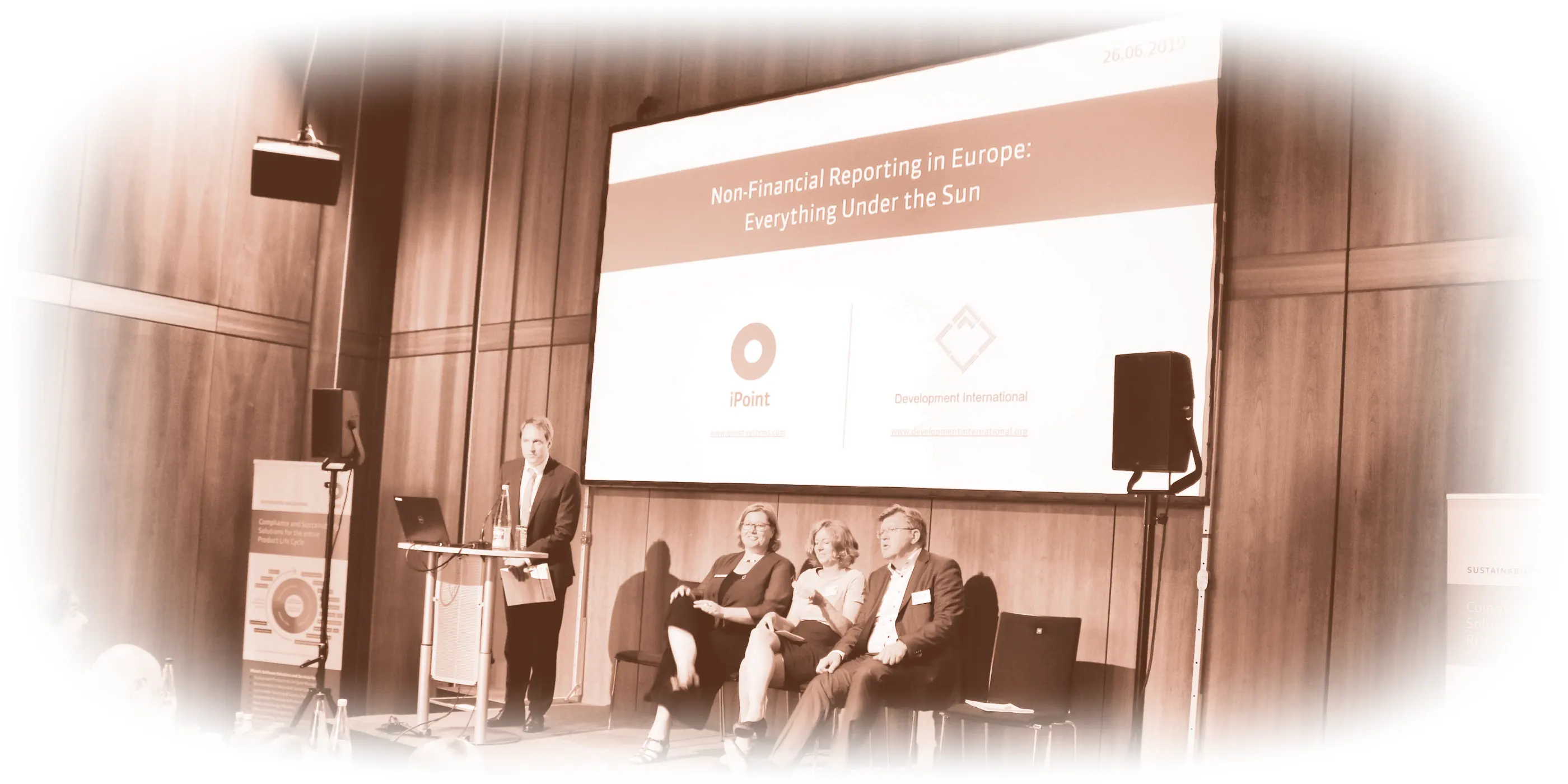 Photograph of a panel discussion with iPoint on non-financial reporting in Europe